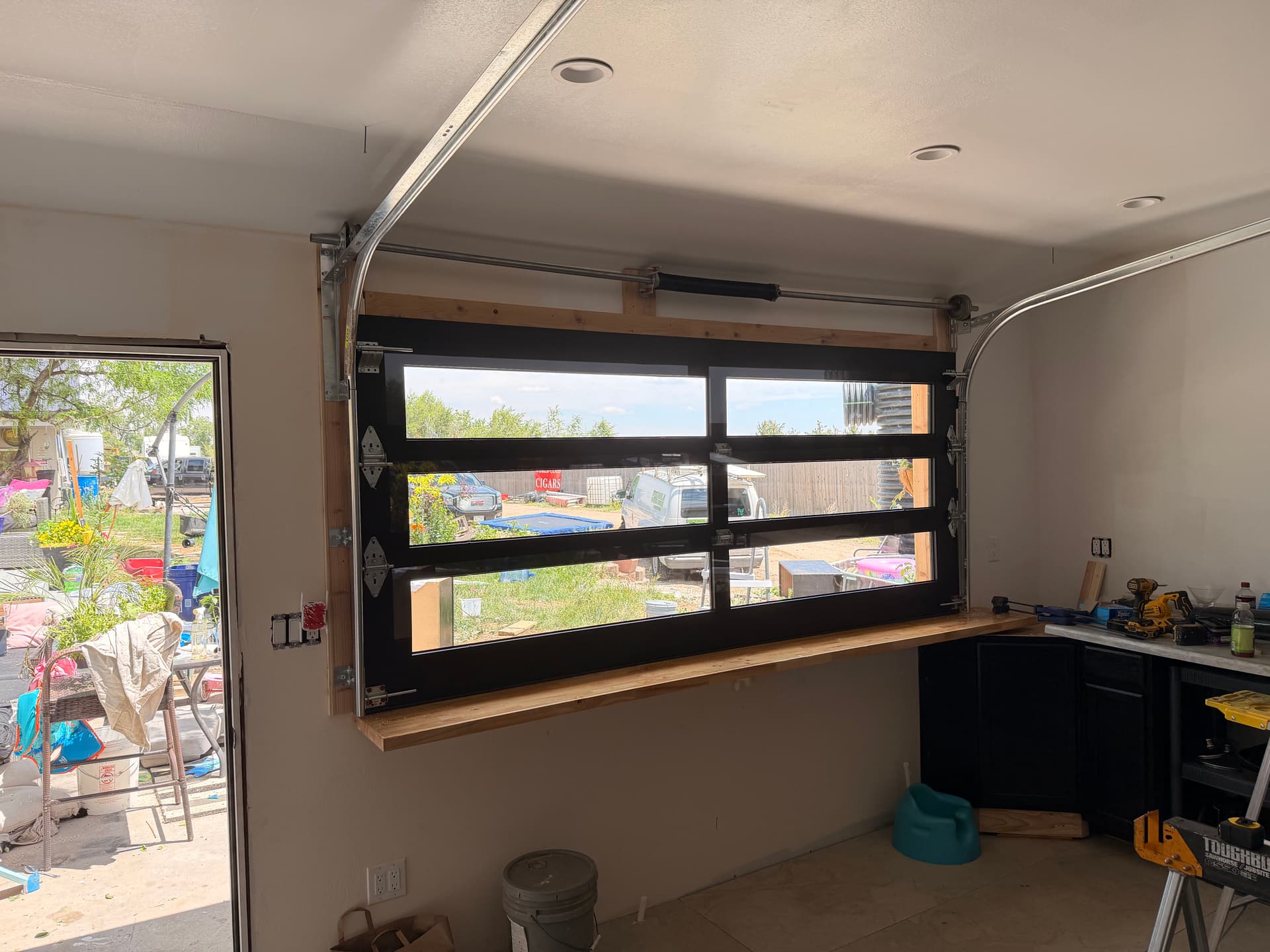 Full-View Glass Door Turned This Kitchen Wall Into a Bar Pass-Through image