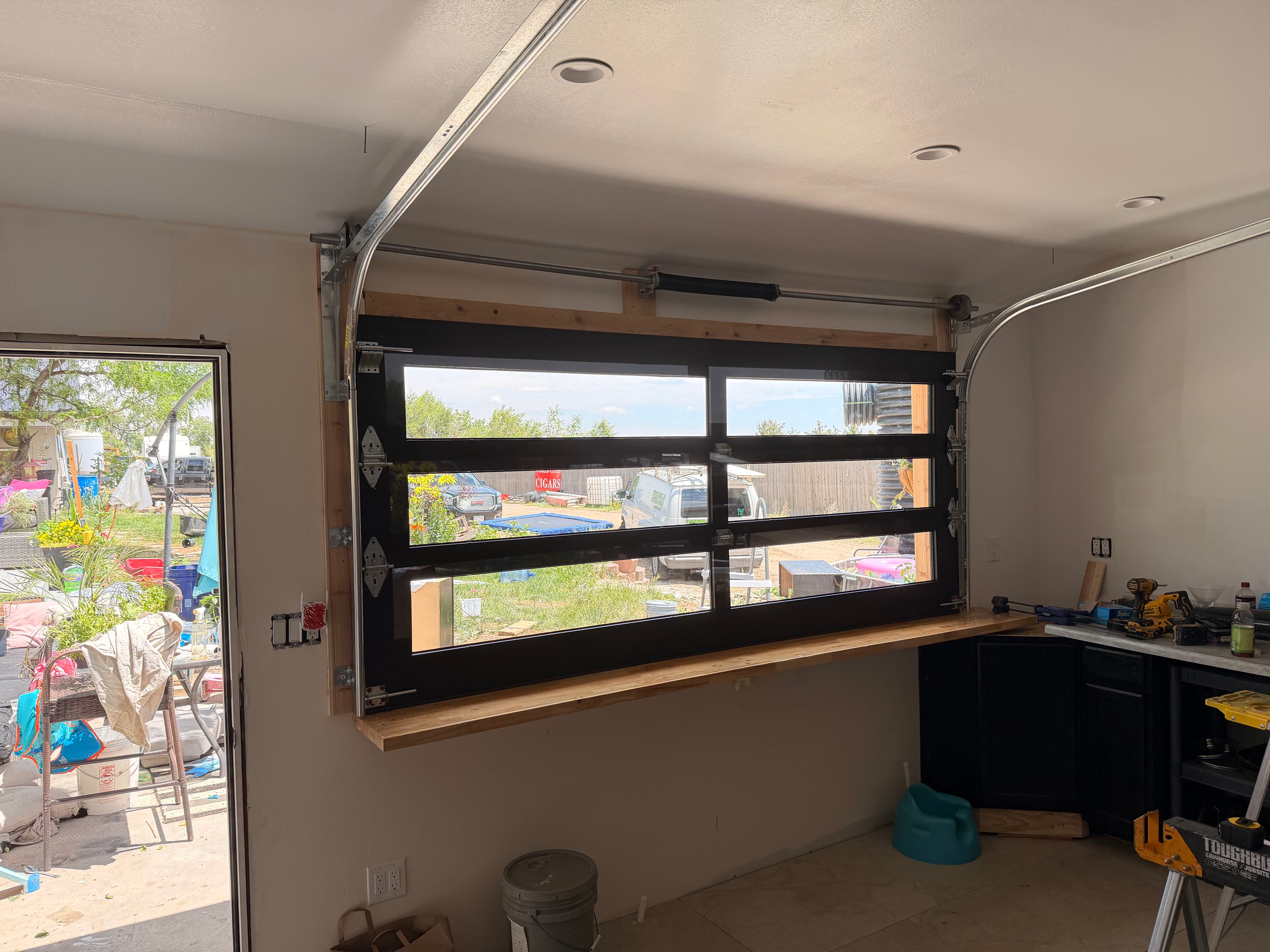 Project Full-View Glass Door Turned This Kitchen Wall Into a Bar Pass-Through image