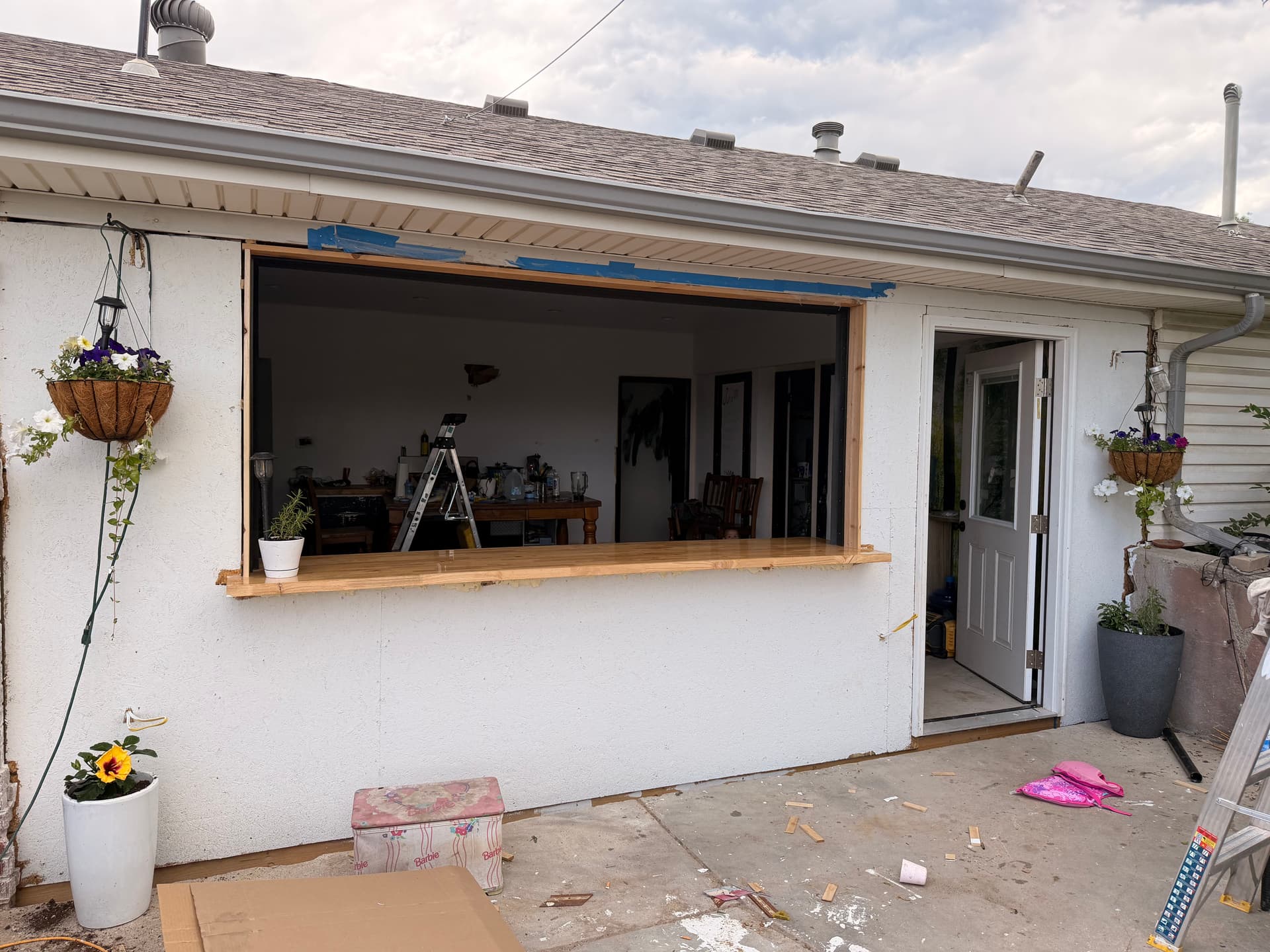 Gallery photos for Full-View Glass Door Turned This Kitchen Wall Into a Bar Pass-Through: Image #3