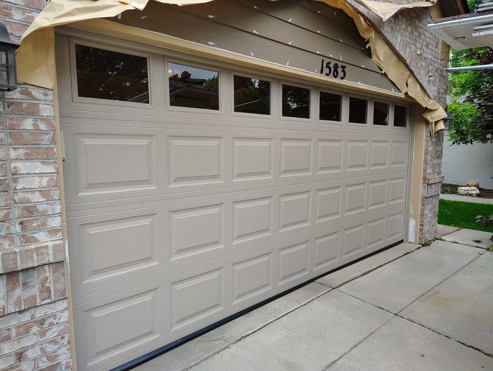 Elevate Your Home with a Sandstone Garage Door