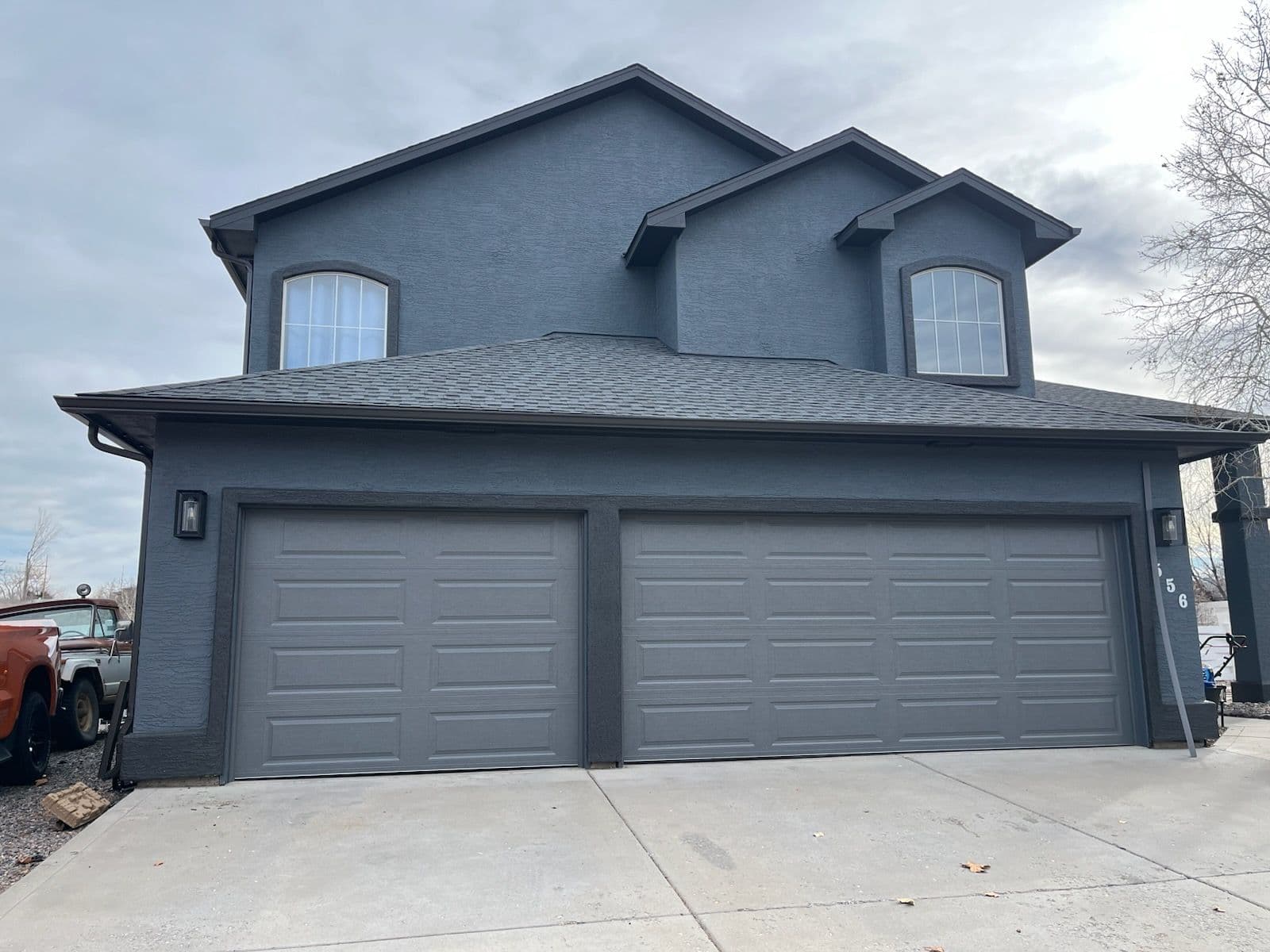 Project Sleek Charcoal Gray Garage Doors Elevate Curb Appeal image