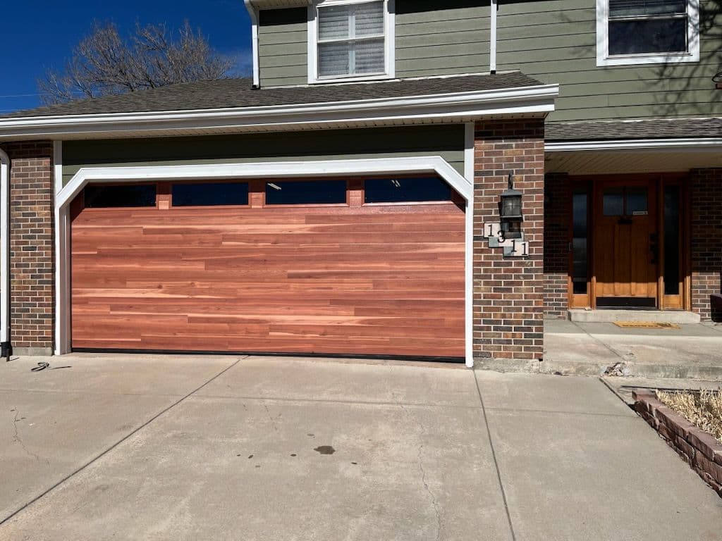 Stunning Cedar Plank Garage Door Upgrade for Charming Home image