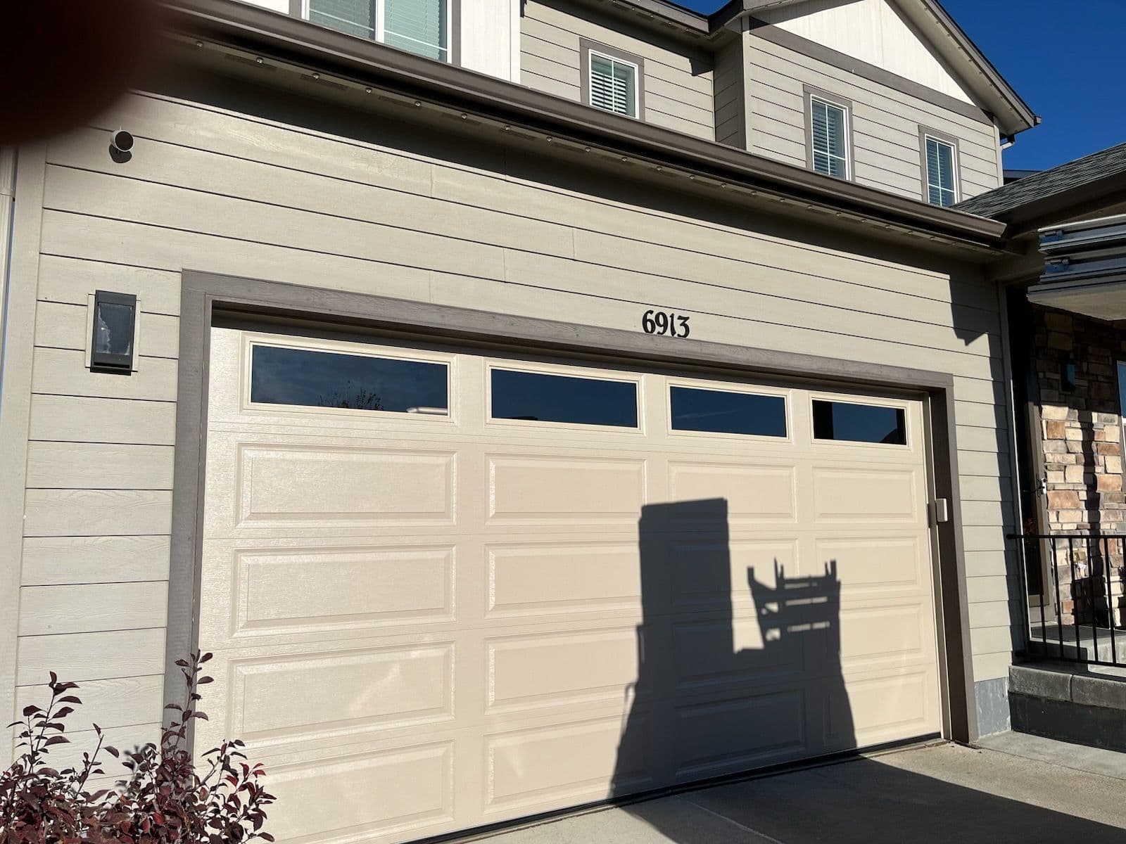 Stunning New Garage Door Installation with Sunlit Panels image